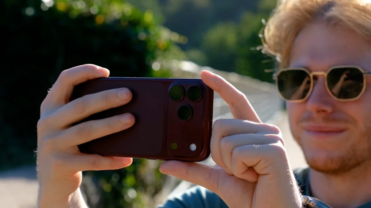 Alex testing a smartphone camera outdoors